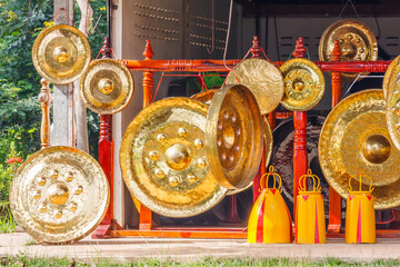 Gongs hanging outside a workshop