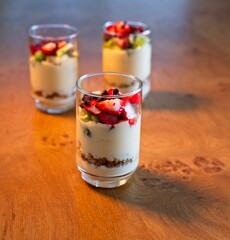 Parfait dessert with yogurt, strawberry, raspberry, and chocolate chips