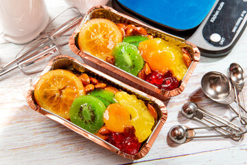 fruitcake in a loaf pan on a wooden table