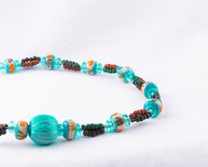 Multi-color turquoise bead necklace isolated on white