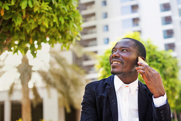 African man talking on phone
