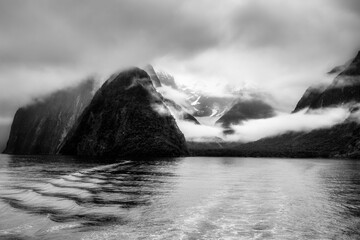 Dramatic moody Milford Sound still beautiful in the pouring rain low cloud and mist