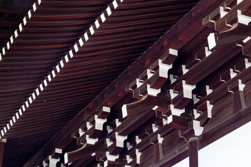 Fototapeta na wymiar Japanese & Chinese Temple use of complex architectural Dougong structural timber roof beam bracket system