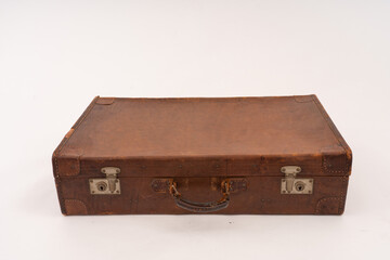 Brown leather Vintage Suitcase on white background.