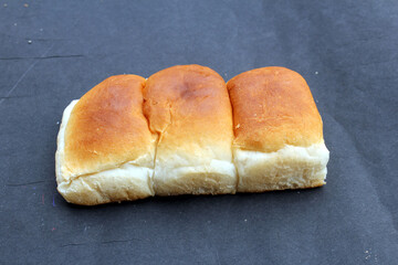 Bread, bakery icon, sliced fresh wheat bread isolated on black background