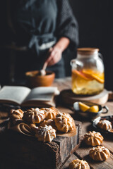 Woman cooks in a vintage kitchen on wooden tablet. Healthy drink, Eco, vegan.