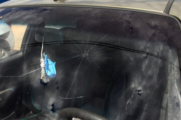 Terrible dangerous car after a fatal accident. Broken windshield. A broken car with broken glass....