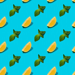Lemon slices and mint leaves seamless pattern on blue background. 