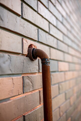 Gas pipe in a brick wall.