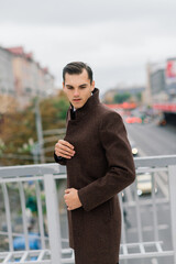 Man in a stylish suit. Businessman in an autumn city, fashion