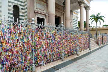 Colorful, religious ribbons that have tied believers to the old iron fence of the Our Lady of Grace Cathedral (Nossa Senhora Nazare) in Belem, capital of the state of Para, Brazil.