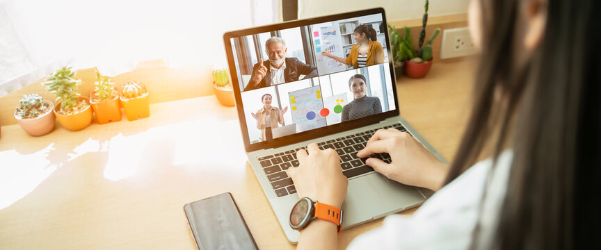 Businesswoman and Business team in video conference for protection covid-19.woman watching laptop webinar video course at home office.Webinar,social distancing,e learning and seminar online Concept.