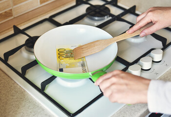 money is fried in a pan. euro banknote

