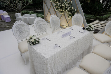 Beautiful and simple elegant wedding ceremony and decoration stage with white flowers background concept for bride and bridegroom