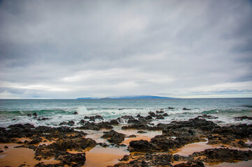 The island of Molokini off Maui under stormy weather. Croissant  shaped crator.