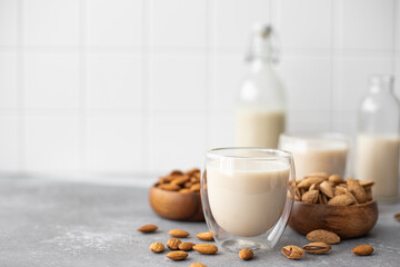homemade almond milk in glasses and bottle