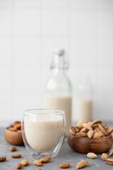 homemade almond milk in glasses and bottle