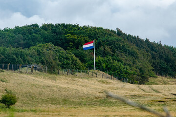 Dutch landscape with flag of the Netherlands