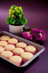 Ancient egg cakes in paper cup with purple background