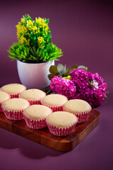 Ancient egg cakes in paper cup with purple background
