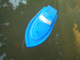 kayak on the water. Blue speed boat or fishing boat  in lake or  sea. Marine or naval boat  floating. Motor Boating  in lake.