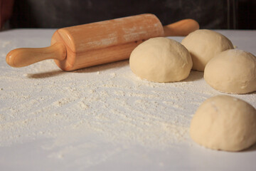 Dough on the white bread in the kitchen