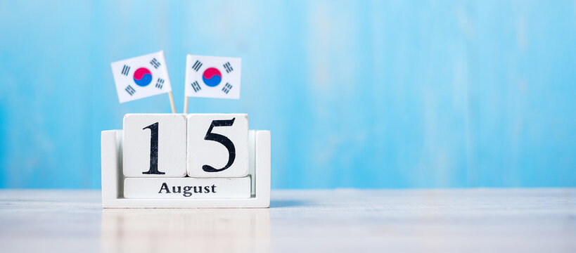 Wooden Calendar Of August 15th With Miniature  Republic Of Korea Flags. Independence Day, National Liberation Day Of Korea, Nation Holiday Day And Happy Celebration Concepts