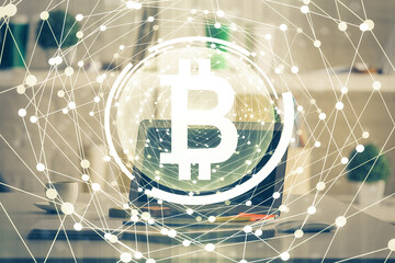 Multi exposure of blockchain theme hologram and table with computer background. Concept of bitcoin...