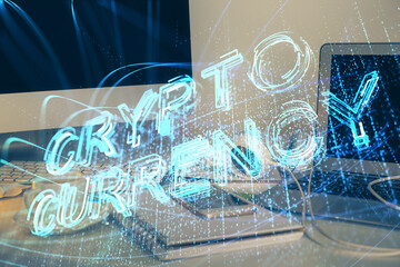 Multi exposure of blockchain theme hologram and table with computer background. Concept of bitcoin crypto currency.