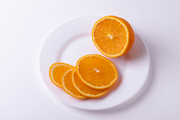 sliced citruses on white 