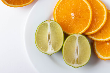 sliced citruses on white 