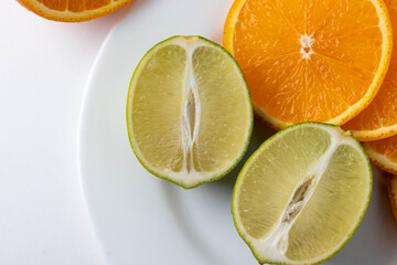 sliced citruses on white 