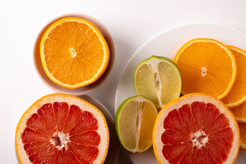 sliced citruses on white 