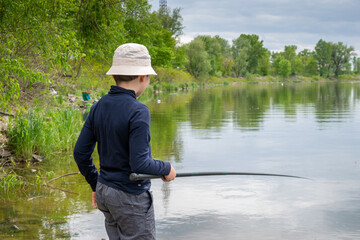 Boy catching fish