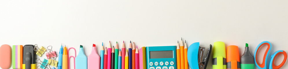 Frame of school supplies on white background, space for text