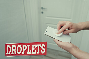 Conceptual hand writing showing Droplets. Concept meaning very small drop of a liquid can be found...