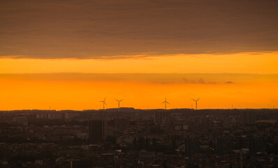 Sunset over Brussels in Belgium with eolian wind mills in background and great colours