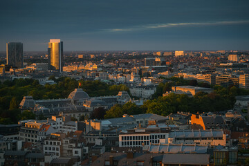 Amazing summer sunset top view over Royal Palace in Brussels with lovely light and the flag of Belgium on top of the builidng