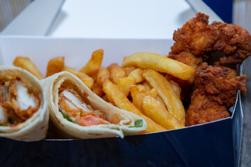 Chicken wrap with pickles, potatoes and chicken crispy meat