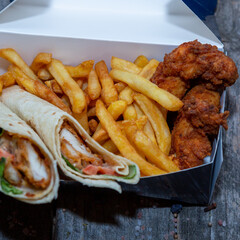 Chicken wrap with pickles, potatoes and chicken crispy meat