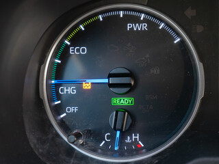 Hybrid system indicator on the instrument panel of a hybrid electric and gasoline car