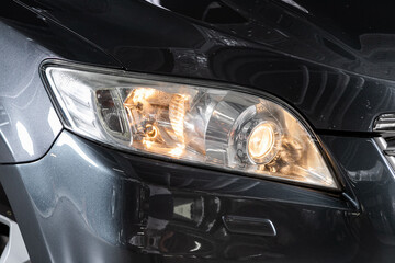 Obraz na płótnie Canvas Detail light close up of on new car. Exterior detail ..