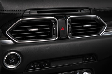 Obraz na płótnie Canvas Close up car ventilation system and air conditioning - details and controls of modern car..