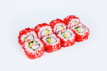 Japanese Sushi in red flying fish roe (Tobiko caviar) isolated on gray background. California roll with snow crab meat (crab sticks), cucumber, avocado wrapped in nori seaweed and rice. Dish isolation