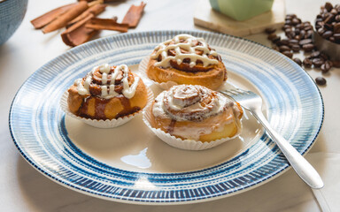 Cinnamon rolls, freshly baked on a plate kitchen tabletop