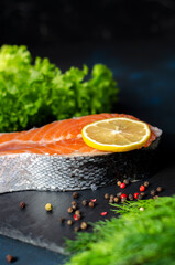 red fish steak with herbs, spices and lemon