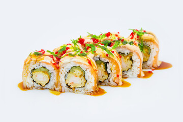 Japanese Sushi Roll with tempura shrimp, cumber, rockfish isolated on white. Menu isolation. served with sauce Hiyasi wakame chuka and flying fish roe (Tobiko caviar). Roll with salmon and eel on top
