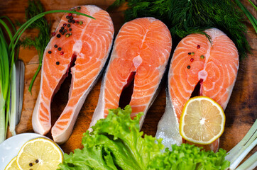 red fish steak with herbs, spices and lemon
