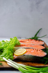 red fish steak with herbs, spices and lemon