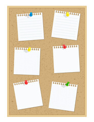 コルクボードに貼られたメモ用紙と押しピン